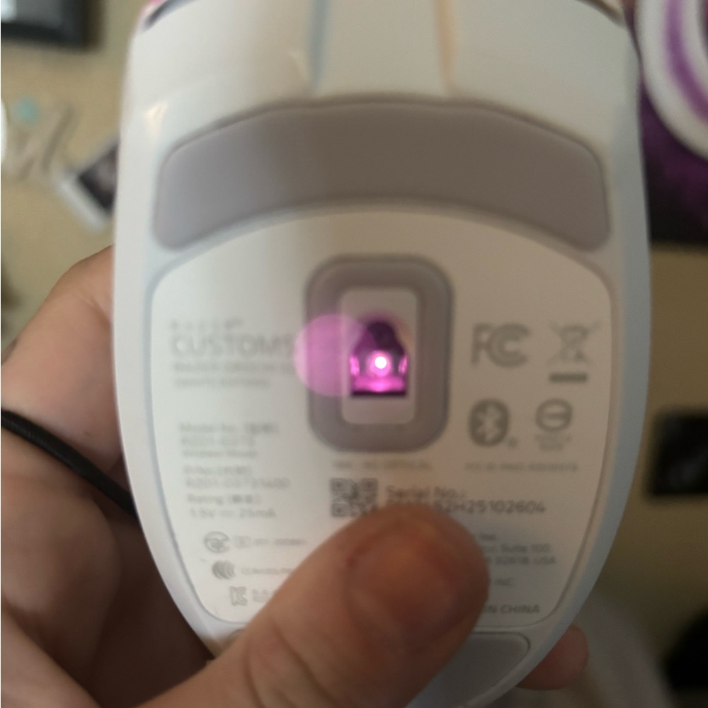 White Wireless Mouse with Pink Sensor Light